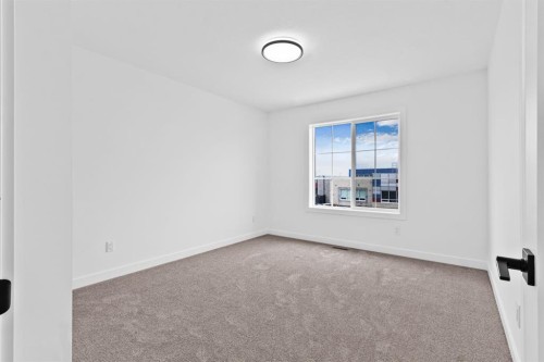 8 Ranchers Meadows, Okotoks, AB - Indoor Photo Showing Other Room