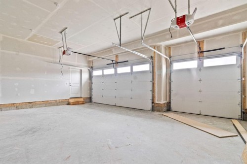 8 Ranchers Meadows, Okotoks, AB - Indoor Photo Showing Garage