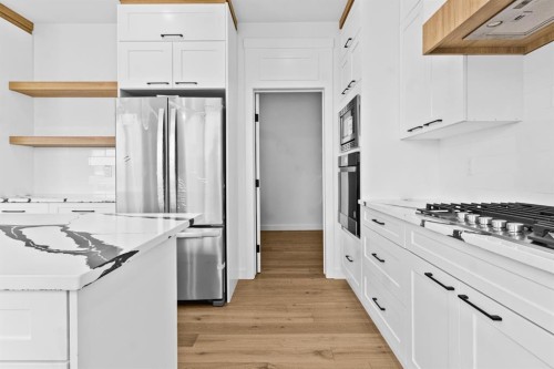 8 Ranchers Meadows, Okotoks, AB - Indoor Photo Showing Kitchen With Upgraded Kitchen