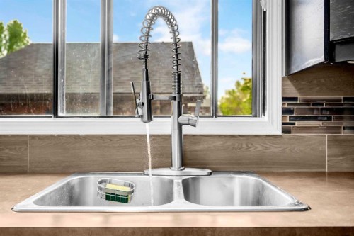 54 Templegreen Road Ne, Calgary, AB - Indoor Photo Showing Kitchen With Double Sink