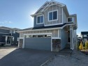 91 Sundown Crescent, Cochrane, AB  - Outdoor With Facade 