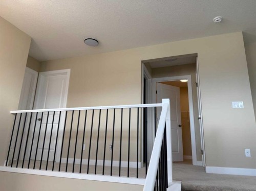 91 Sundown Crescent, Cochrane, AB - Indoor Photo Showing Other Room