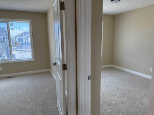 91 Sundown Crescent, Cochrane, AB - Indoor Photo Showing Other Room