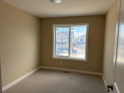 91 Sundown Crescent, Cochrane, AB - Indoor Photo Showing Other Room