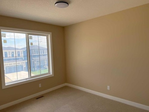 91 Sundown Crescent, Cochrane, AB - Indoor Photo Showing Other Room