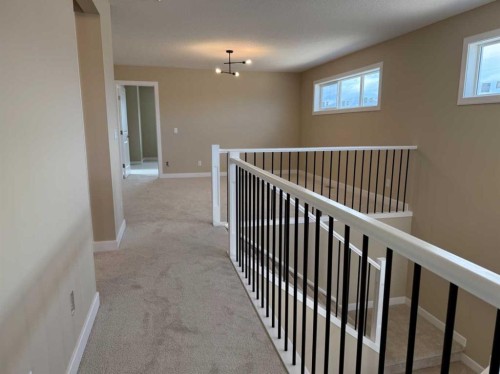 91 Sundown Crescent, Cochrane, AB - Indoor Photo Showing Other Room