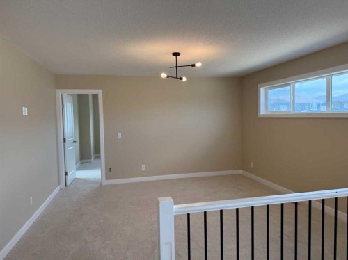 91 Sundown Crescent, Cochrane, AB - Indoor Photo Showing Other Room