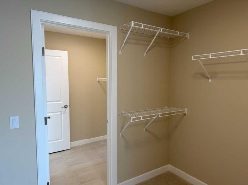91 Sundown Crescent, Cochrane, AB - Indoor With Storage