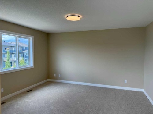 91 Sundown Crescent, Cochrane, AB - Indoor Photo Showing Other Room