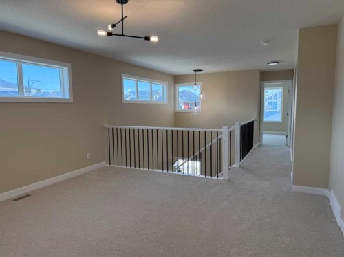 91 Sundown Crescent, Cochrane, AB - Indoor Photo Showing Other Room