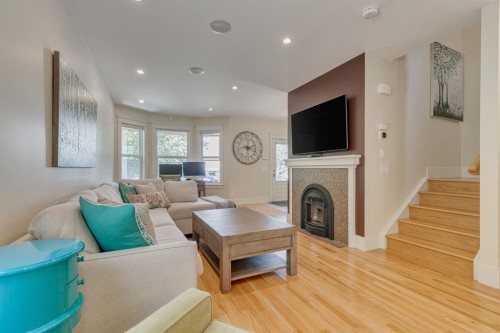 609 23 Avenue Sw, Calgary, AB - Indoor Photo Showing Living Room With Fireplace