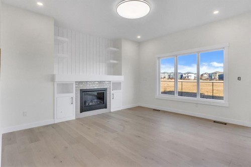 14 Ranchers Meadows, Okotoks, AB - Indoor Photo Showing Living Room With Fireplace