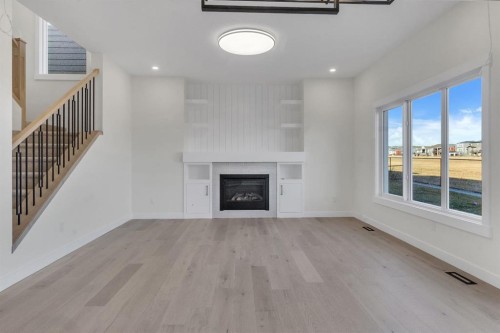 14 Ranchers Meadows, Okotoks, AB - Indoor Photo Showing Living Room With Fireplace