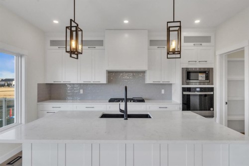 14 Ranchers Meadows, Okotoks, AB - Indoor Photo Showing Kitchen With Upgraded Kitchen