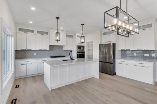 14 Ranchers Meadows, Okotoks, AB - Indoor Photo Showing Kitchen With Stainless Steel Kitchen With Upgraded Kitchen