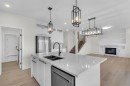 14 Ranchers Meadows, Okotoks, AB  - Indoor Photo Showing Kitchen With Double Sink With Upgraded Kitchen 