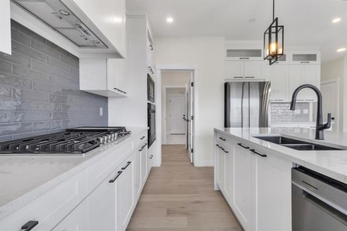 14 Ranchers Meadows, Okotoks, AB - Indoor Photo Showing Kitchen With Stainless Steel Kitchen With Double Sink With Upgraded Kitchen