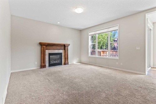 77 Auburn Glen Common Se, Calgary, AB - Indoor Photo Showing Living Room With Fireplace