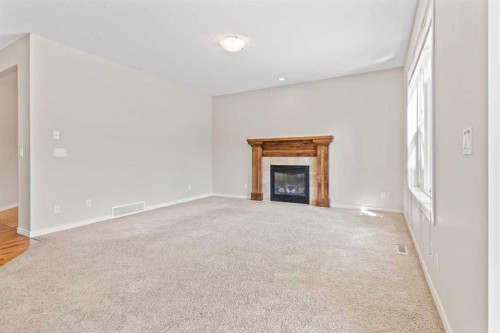 77 Auburn Glen Common Se, Calgary, AB - Indoor Photo Showing Living Room With Fireplace