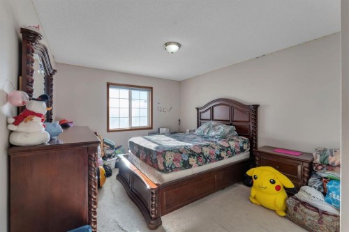 717 Coral Springs Boulevard Ne, Calgary, AB - Indoor Photo Showing Bedroom