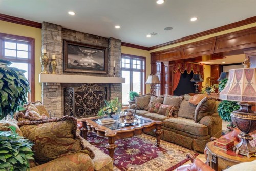 240046 284, Rural Kneehill County, AB - Indoor Photo Showing Living Room With Fireplace