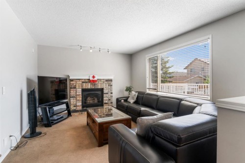 39 Harvest Oak Green Ne, Calgary, AB - Indoor Photo Showing Living Room With Fireplace