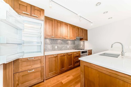 1126-222 Riverfront Avenue Sw, Calgary, AB - Indoor Photo Showing Kitchen With Double Sink