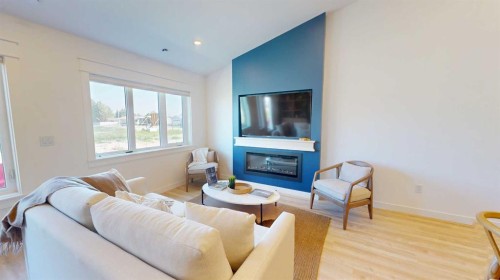 731 7 Avenue West, Cardston, AB - Indoor Photo Showing Living Room With Fireplace