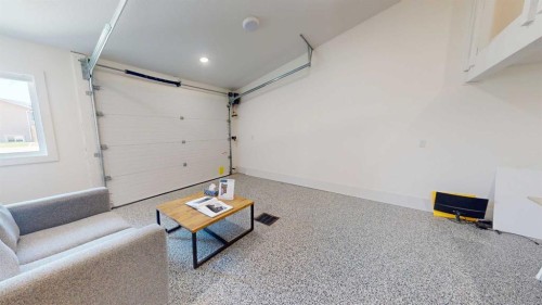 731 7 Avenue West, Cardston, AB - Indoor Photo Showing Garage