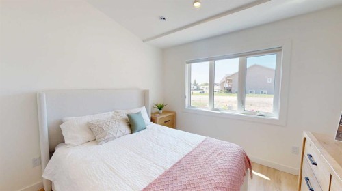 731 7 Avenue West, Cardston, AB - Indoor Photo Showing Bedroom