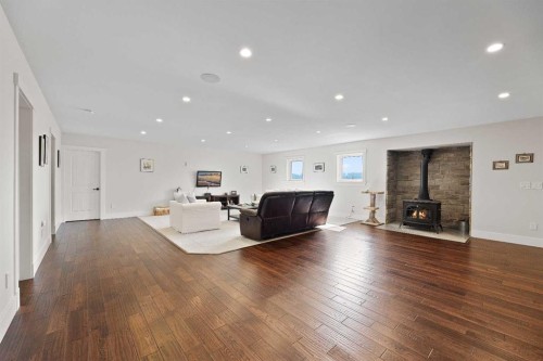 32325 Range Road 24, Rural Mountain View County, AB - Indoor Photo Showing Living Room With Fireplace