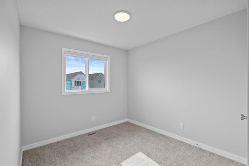 114 Lewiston Way Ne, Calgary, AB - Indoor Photo Showing Other Room