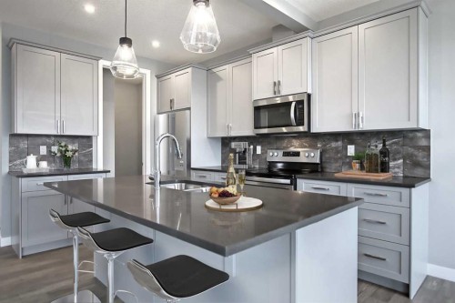 47 Agate Road, Cochrane, AB - Indoor Photo Showing Kitchen With Upgraded Kitchen