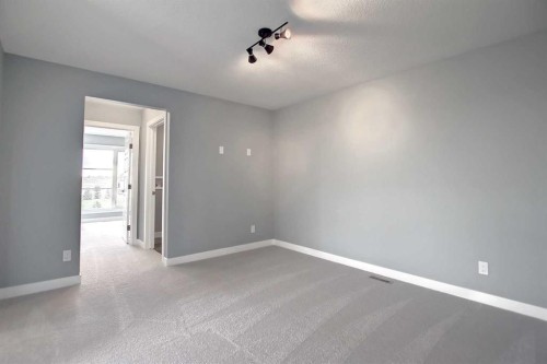 47 Agate Road, Cochrane, AB - Indoor Photo Showing Other Room