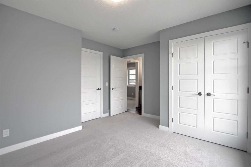 47 Agate Road, Cochrane, AB - Indoor Photo Showing Other Room