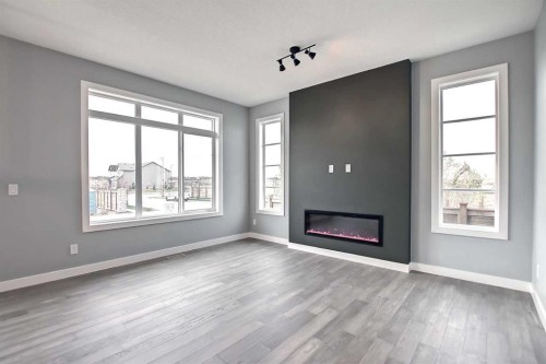 47 Agate Road, Cochrane, AB - Indoor Photo Showing Living Room With Fireplace