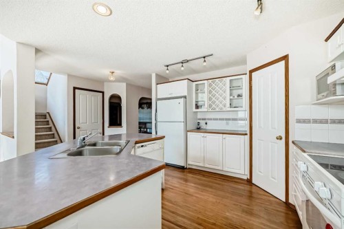 42 Sierra Nevada Green Sw, Calgary, AB - Indoor Photo Showing Kitchen With Double Sink