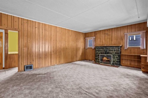 404 Otter Street, Banff, AB - Indoor With Fireplace
