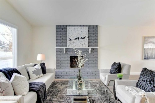 272 Acadia Drive Se, Calgary, AB - Indoor Photo Showing Living Room With Fireplace