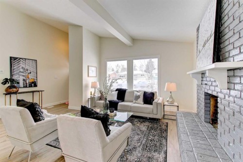 272 Acadia Drive Se, Calgary, AB - Indoor Photo Showing Living Room With Fireplace