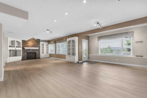 86 Springborough Green Sw, Calgary, AB - Indoor Photo Showing Other Room With Fireplace