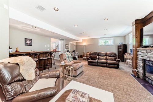 52 Winter Drive, Olds, AB - Indoor Photo Showing Living Room With Fireplace