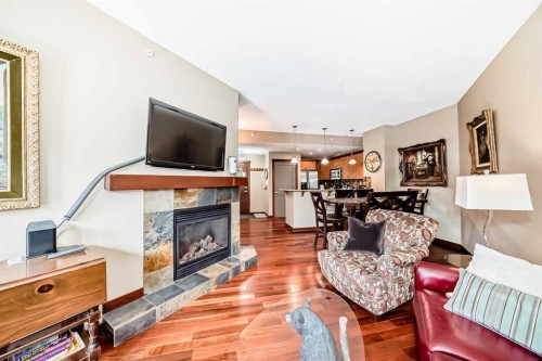 311-1002 8 Avenue, Canmore, AB - Indoor Photo Showing Living Room With Fireplace