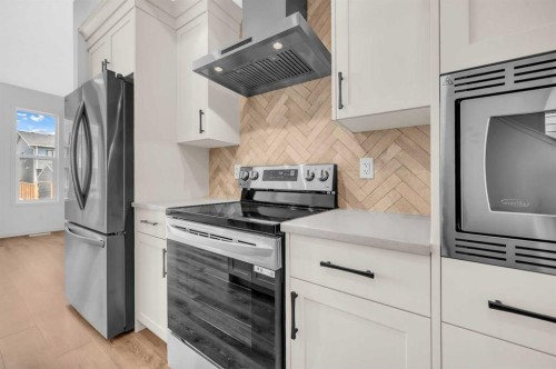 32 Rowmont Common Nw, Calgary, AB - Indoor Photo Showing Kitchen