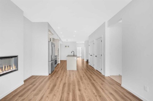32 Rowmont Common Nw, Calgary, AB - Indoor With Fireplace