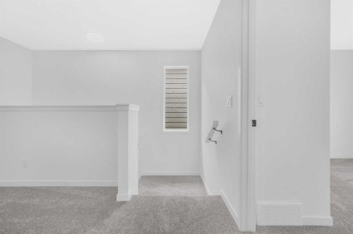 32 Rowmont Common Nw, Calgary, AB - Indoor Photo Showing Other Room