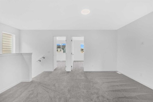 32 Rowmont Common Nw, Calgary, AB - Indoor Photo Showing Other Room