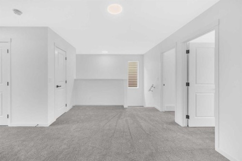 32 Rowmont Common Nw, Calgary, AB - Indoor Photo Showing Other Room