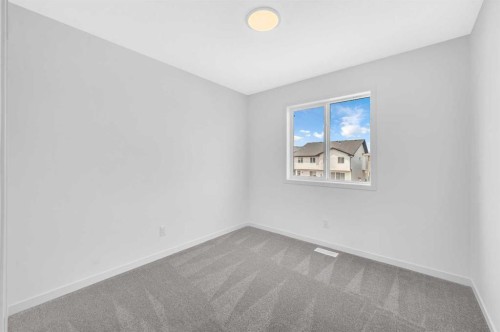 32 Rowmont Common Nw, Calgary, AB - Indoor Photo Showing Other Room