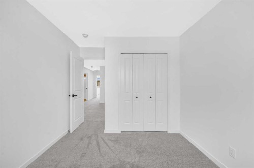 32 Rowmont Common Nw, Calgary, AB - Indoor Photo Showing Other Room